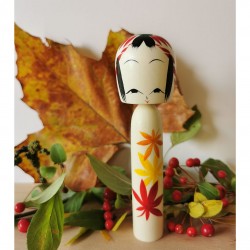 1-Three leaves in shades of red, orange and yellow. Large Kokeshi kaede by Wagatsuma Noboru.