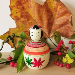 1- Kokeshi decorated with green and dark red leaves. Autumn ejiko kokeshi by  Wagatsuma Noboru.